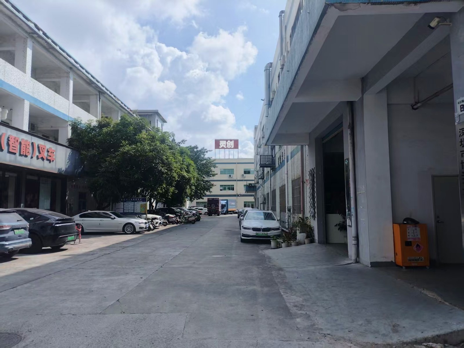 Factory yard of the Lingvent Design production base in Guangdong, China, with the rooftop sign on the main building