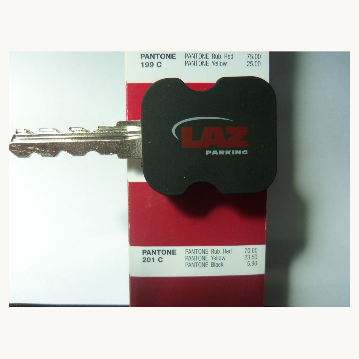 Black soft PVC key cover moulded around a standard metal key