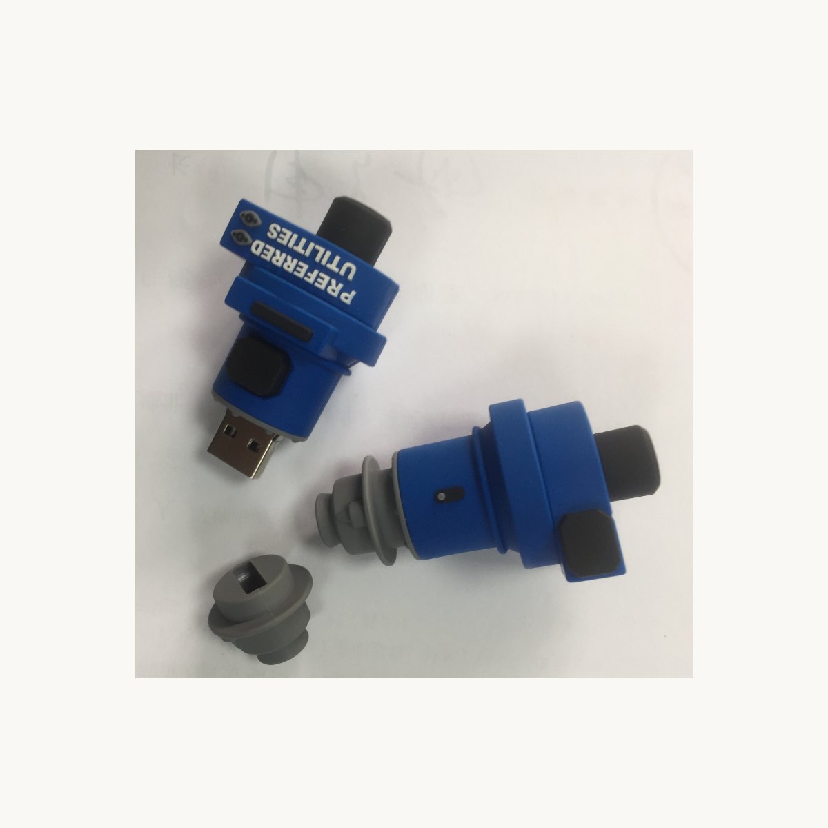 Blue soft PVC USB casing moulded as an industrial pipe fitting